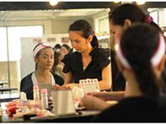 women working at make up table